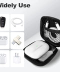 Open Carry Anywhere EVA Earbud Case With Carabiner holding earphones, USB drive, cables, shown with various small accessories, black.