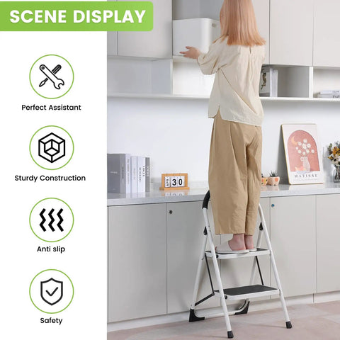 Person using Two Step Folding Ladder With Extra Wide Anti Slip Pedals And Handgrip in kitchen, reaching top cabinet.