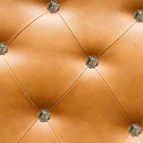 Top Shelf Heavy Rust Proof Vintage Upholstery Tacks 20 Piece Set Knockout Flower Design hardware nails on tan leather upholstery.