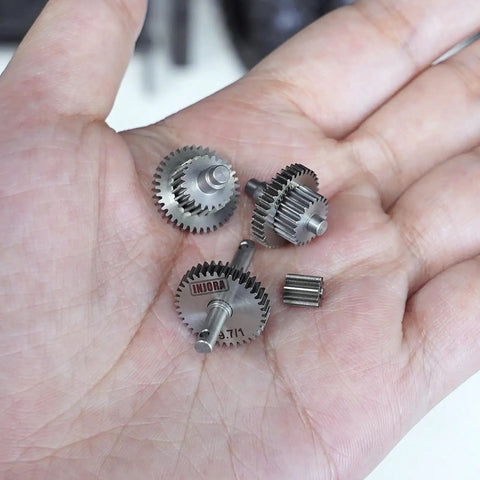 Stainless Steel 9.7 To 1 Overdrive Transmission Gear Pinion Set For 1/18 TRX4M RC Crawler Upgrade in hand, CNC machined.