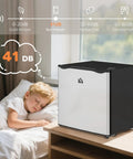 Keep Your Stash Ice Cold With This Sick 1.1 Cu Ft Countertop Freezer That Masters Tiny Spaces For Dorm Rooms And Apartments While Delivering Crisp Adjustable Cooling And Modern Silver Style, compact freezer near sleeping child.