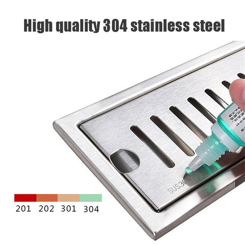 Top Shelf Rectangular Linear Shower Drain In Rust Resistant 304 Stainless Steel With No Sweat Hair Catcher Grate Slick Gold Tone 10X60CM close-up of SUS304 marking.