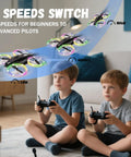 Kids flying toy demonstration with 3 speed mode, two boys using controllers, Kids RC Drone With Altitude Hold Headless Mode Propeller Guards LED Lights And 3 Speed Modes Easy One Key Takeoff And Landing Dope Gift For Boys And Girls visible