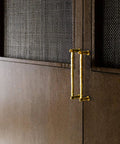 Gold Brass Bamboo Shape Cabinet Handles Set, Antique Brushed Copper Finish, installed on wooden cabinet doors.