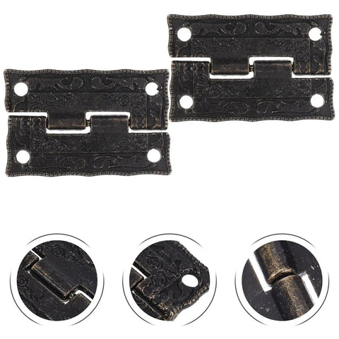Close-up of two dark brown metal hinges, detailing the vintage pattern, part of Vintage Printed Antique Cabinet Hinges 10 Pack For Small Jewelry Boxes And Wooden Craft Boxes Decorative Hardware For DIY Furniture Makeovers Old School Charm Treasure Chest And Trinket Storage Retro Chest Hinges.