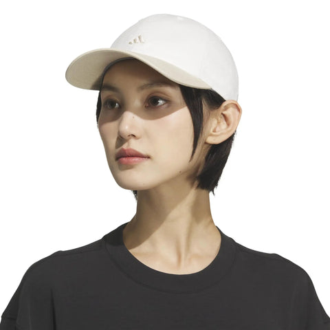 Woman wearing Womens Saturday Hat with Relaxed Fit Strapback Baseball Cap Featuring Climacool Breathable Fabric Quick Dry Sweatband