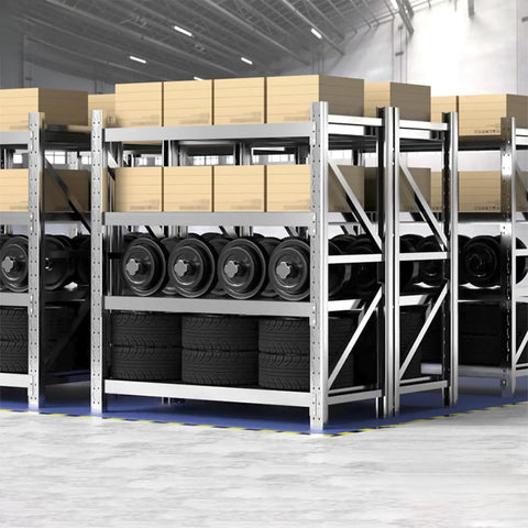 Rock Solid Heavy Duty Garage Shelving Four Tier Commercial Steel Storage Rack Industrial Grade Metal Organizer For Home Pantry Kitchen And Workshop With Heavy Gauge Steel Construction And Cross Bracing storing tires and boxes.
