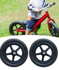 Two 11 Inch Non Inflatable Balance Bike Replacement Wheels for Kids with Pentagram Hub shown with red bike in background
