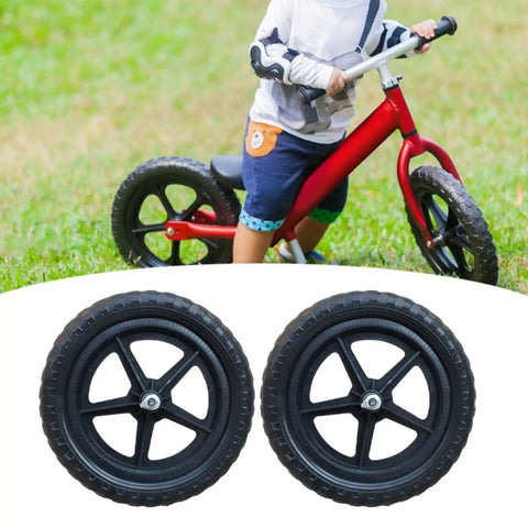 Two 11 Inch Non Inflatable Balance Bike Replacement Wheels for Kids with Pentagram Hub shown with red bike in background