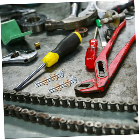 Door Hinge Repair Kit Pin And Bushing For Automotive Door Hardware with tools on a workbench, including pliers and screwdrivers.