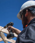 Person using drill to secure Strong-Drive Framing Screws 0.160 Inch By 3 Inch Sawtooth Point 6-Lobe Drive in wooden frame.