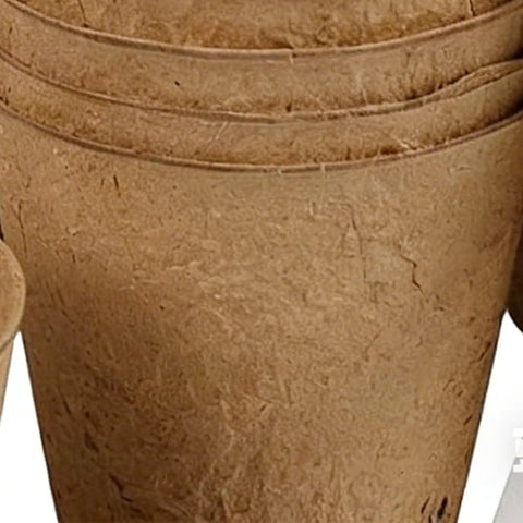 Stack of breathable paper pulp planters from Seedling Pot Set For Germination Round Nursery Pots For Yard Balcony Garden.