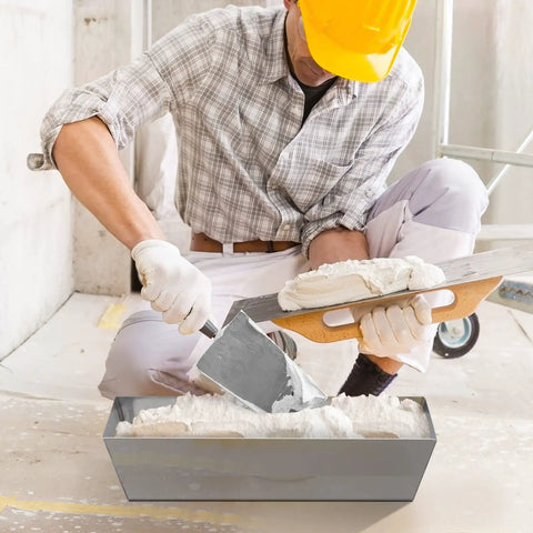 Worker using Heavy Duty 12 Inch Stainless Steel Mud Pan For Drywall, Watertight Reinforced Pan With Tapered Sides, Pro Grade Mud Mixing