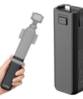 Hand holding 5000mAh Battery Grip For Pocket 4 By 3 Camera With 20W Fast Charge, wireless microphone pass through, tripod thread.