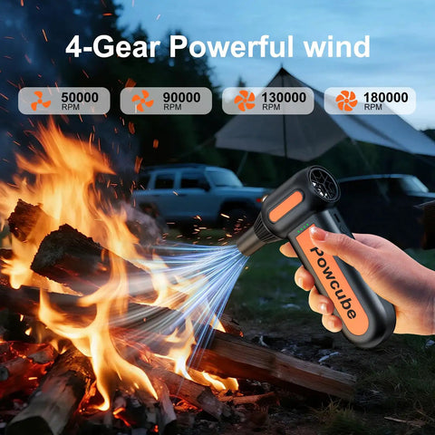 Hand using 2 In 1 Go Anywhere Cordless Air Duster And Mini Vacuum With 180000RPM Turbo Motor near campfire.