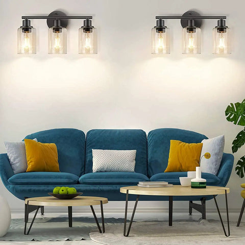Living room with blue sofa, wall sconce lighting featuring Clear Glass Lamp Shade Replacement Globe For Chandelier Pendant And Wall Sconce Lighting Cylinder Glass Shade 5.5 Inch Tall 3.5 Inch Diameter 1.65 Inch Top Fitter Fits Most Fixtures.