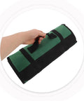 Hand holding Portable Chef Knife Roll Bag With Roll Up Design Multiple Pockets And Large Capacity Fabric Construction
