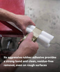 Person using Extra Heavy Duty Olive Duct Tape 6969, Industrial Strength Water-Resistant 10 mil, 48 mm x 54.8 m Roll on pipes.