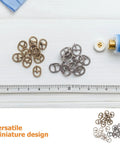 150 Pcs Mini Buckles Alloy Tiny Sewing Fasteners With Single Prong Quick Release displayed on white background with ruler