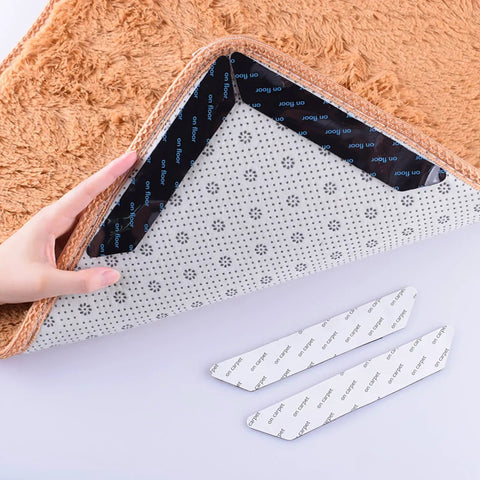 Person applying No Slip Carpet Gripper Kit 16 Pack Reusable Washable Rug Pads And Edge Clips For Floors And Cars to rug corner