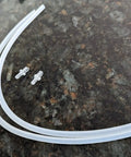 Keep Your Brew Game Sharp With These Heavy Duty Replacement Milk Hose Tubes Featuring Two Drip Free Connectors And A Durable Thirty Six Inch Line For Hassle Free Frothing Action Daily showing two transparent milk hoses and connectors.