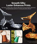 Silk PLA 4kg bundle with 1.75mm filament showcasing 3D printed dinosaur models in gold and silver, emphasizing smooth, silky luster.