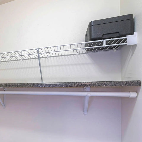 Heavy Duty Wire Shelf Support Brackets Kit For Closets Featuring Solid Metal Bars Wire Shelving Clips Corner Mounts And Screws mounted in wall above a grey countertop.