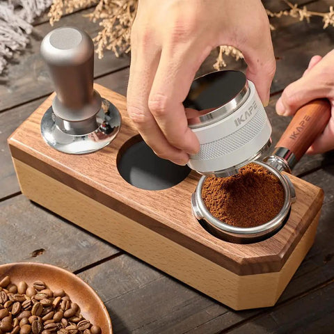 Hands using Wooden Tamping Station For Espresso Anti Slip Tamper Stand And Portafilter Organizer Fits 51mm And 54mm Portafilters Holds Tamper