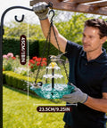 Man installing Solar Powered Hanging Bird Bath Fountain For Outdoors Large Blue Bird Bath With Wireless Pump Easy Install For Hummingbirds Gardens Patio And Backyard