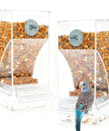 Two Piece Automatic Bird Feeder Kit With Clear Acrylic Hopper And Rock Solid Gravity Valve For Parakeets And Lovebirds, 3.35x2.95x7.28in with seeds and a parakeet.