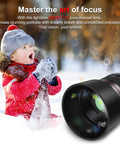 Child in winter clothing plays in snow beside 85mm F1.8 Portrait Manual Focus Lens For EF/EF-S Mount DSLRs No Autofocus Creamy Bokeh Sharp