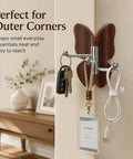 2 Pack Rotating Adhesive Wall Hooks With Rugged Wood Grain Finish flexible swivel hooks holding keys and lanyards in a corner.