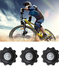 Cyclist with mountain bike and 4X 10T Bicycle Gear Mech Pulley Jockey Wheel Kit for 5-8 speed derailleur displayed below