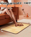 Person sitting on sofa using Cozy Feet Warmer Floor Mat With Ten Heat Settings And Timer, Fast Heating Under Desk Foot Pad For Office Or Home