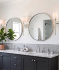 Kira Home Torche 20" Mid Century Modern Wall Sconce for Bathroom Vanity, Pack of 2 beside mirrors in elegant bathroom setting.