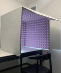 Portable Desktop Sound Booth Packed With High Density Acoustic Foam Cube For Microphones To Block Room Noise and Lock In Straight Fire Vocals Every Day, viewed from an angle showing the interior.