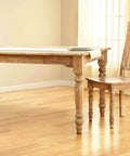 Top Shelf Felt Furniture Protectors For Hardwood Floors Beige Self Stick Pads under wooden table and chair in empty room.