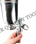 Slick Compact Spray Gun Airbrush Kit With A Hella Precise 0.5mm Nozzle held in hand for fine detail painting.