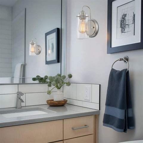 Kira Home Rayne 10" Modern Farmhouse Wall Sconce for Bathroom Vanity, Pack of 2 with brushed nickel finish and clear glass shade.