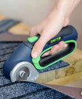 Zeite 4 V Cordless Electric Scissors Cardboard Cutter cutting carpet with easy grip design for home and office tasks.