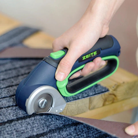 Zeite 4 V Cordless Electric Scissors Cardboard Cutter cutting carpet with easy grip design for home and office tasks.