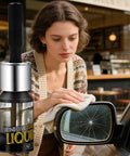 Fast Dry Glass Repair Liquid 5ml Nano Tech Crack Filler used for windshield crack repair on a car side mirror by a woman.