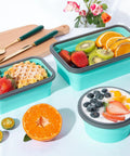 Eight Pack Collapsible Food Storage Containers With Lids filled with fruits, waffles, and yogurt on a table with a cutting board.