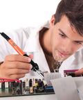 Technician using 60W 110V Adjustable Temperature Soldering Iron Pen Workhorse Pro Grade Portable Welding Tool on electronic circuit board