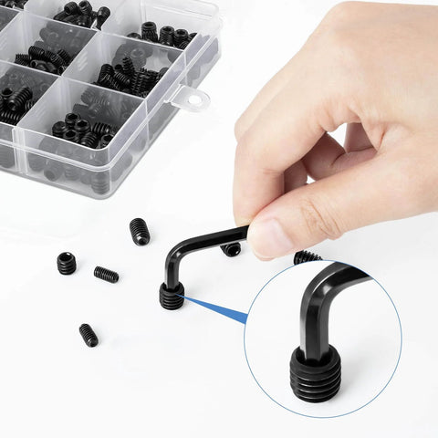 Hand using a hex wrench with 560 Piece Set Screw Kit With 25 Sizes Metric And SAE Assortment Includes 12 SAE And 13 Metric Sets in box
