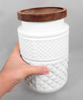 Solid Matte White Glass Food Storage Canisters Set Of Two 1800 Ml Airtight Kitchen Jars With Secure Tight Seals in hand