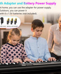 Children playing Dope 61 Key Digital Piano With Dual HiFi Speakers LED Display while adult supervises