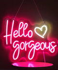 Pink Neon Sign For Wall Decor Reusable LED Light Sign With Dimmable Switch Party Ready For Bachelorette Parties Engagement Parties Weddings And Birthday Celebrations USB Powered Flexible Silicone LED Strip On Clear Acrylic Board 17 By 12 Inches glowing "Hello Gorgeous" design.