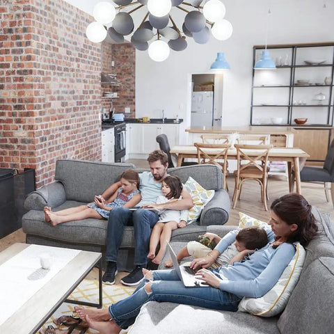 Family relaxing in living room under Super Bright Daylight 5000K A21 LED Bulbs 2500 Lumens E26 Base Non Dimmable 23W