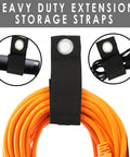 Heavy duty extension storage straps organizing coiled orange extension cords with black durable loops and grommets